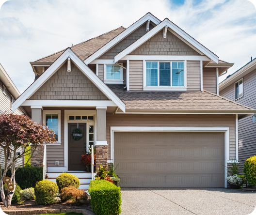 Elegant suburban home featuring garage and landscaped yard